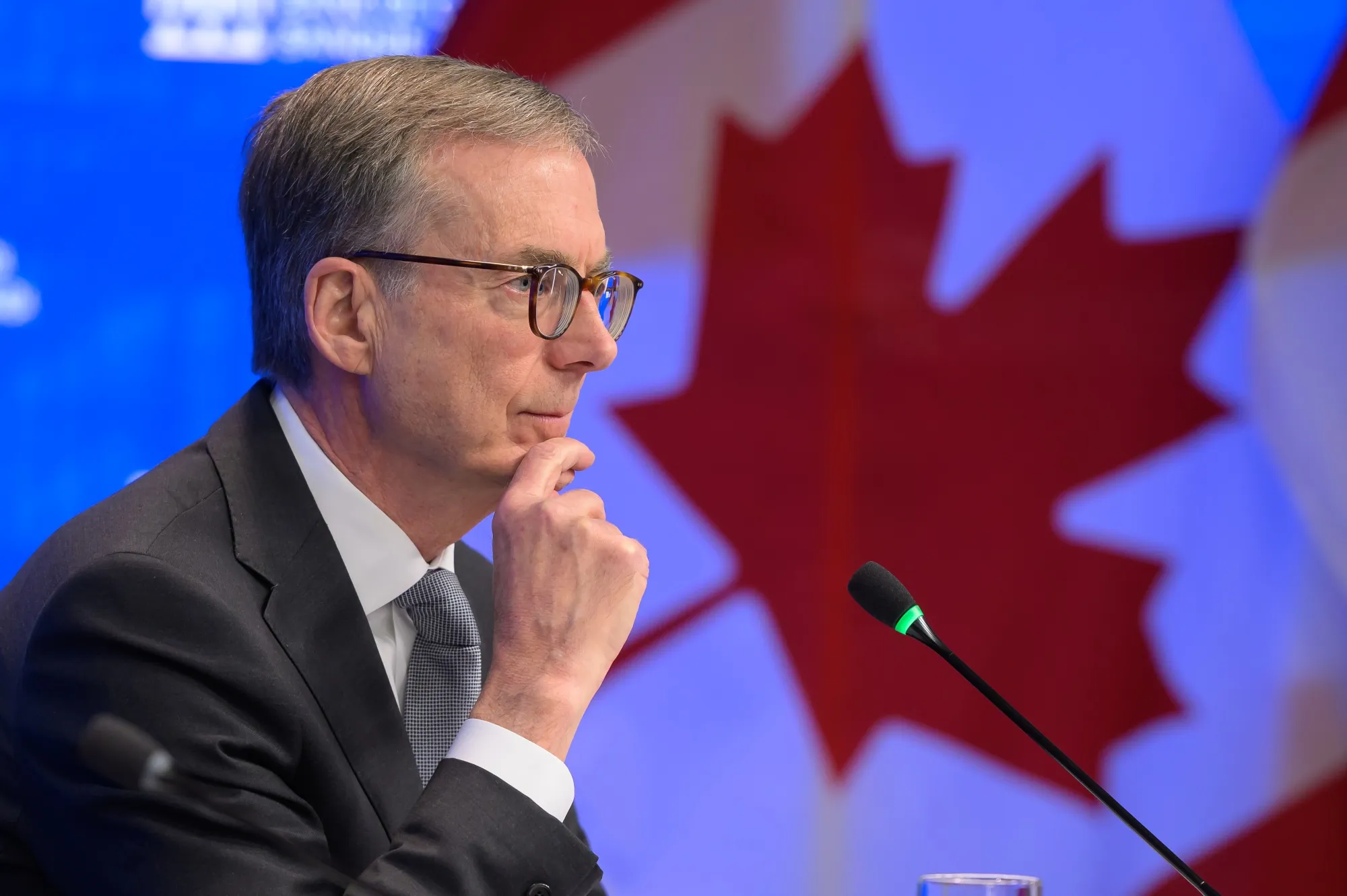 The Bank of Canada Just Hiked Rates for the First Time in Three Years. It Might Not Be the Last. 1 Bank of Canada governor speaking at a press conference in front of a Canada flag